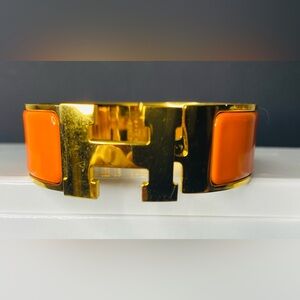 HERMES Signature Orange Enamel and Gold Plated Clic-Clac H GM Wide Bracelet